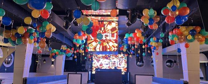 Corporate event balloon decor installation in a Boston office lobby