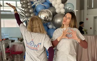 professional balloon installation team creating event décor