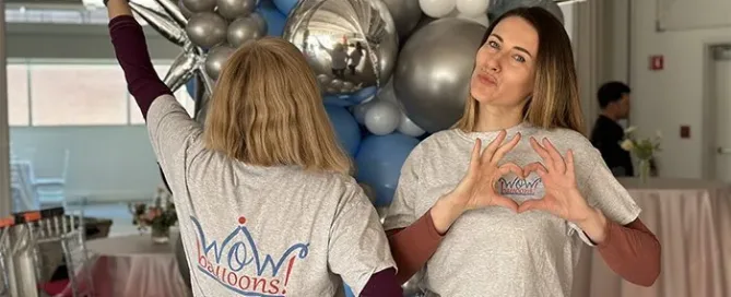 professional balloon installation team creating event décor