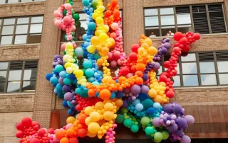 Pride balloon installation rainbow on Squarespace headquarters in New York City