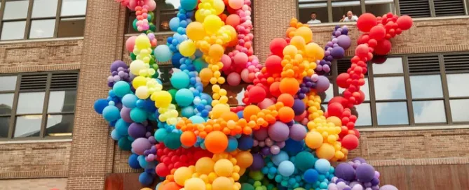 Pride balloon installation rainbow on Squarespace headquarters in New York City